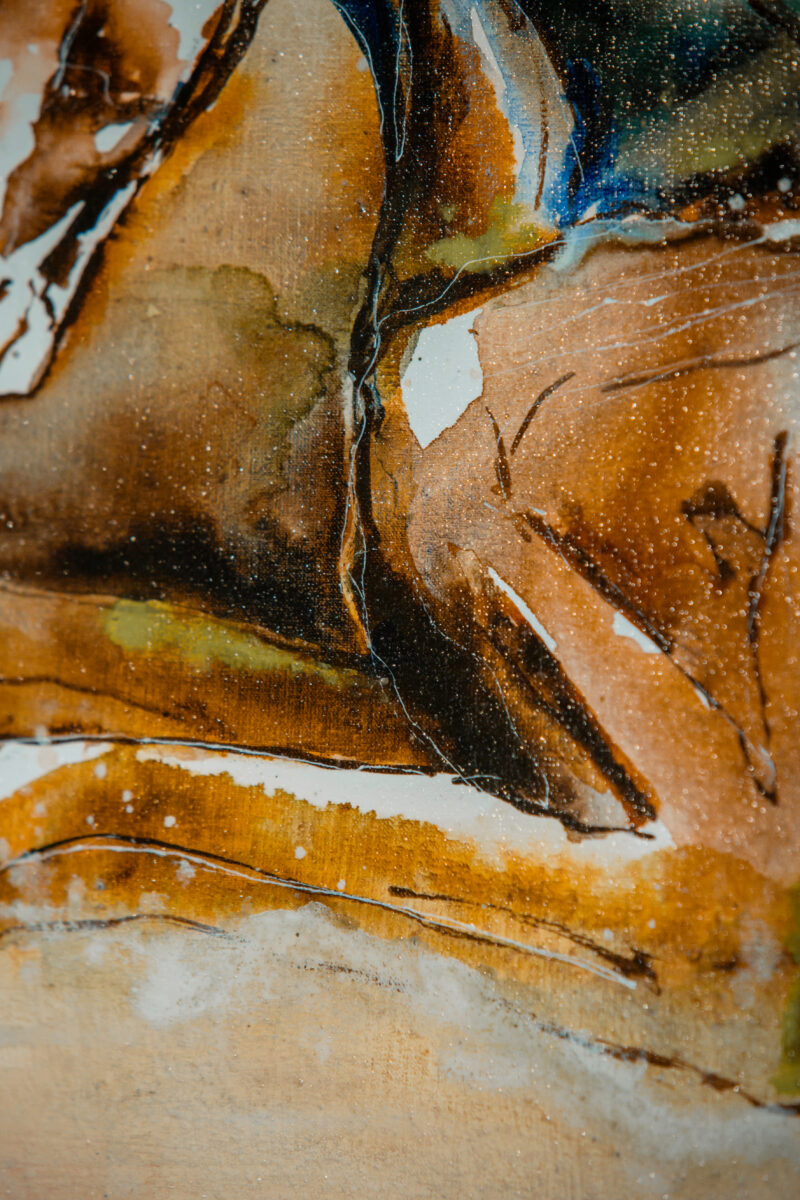 Detail of layered washes and paint splatters across the linen canvas
