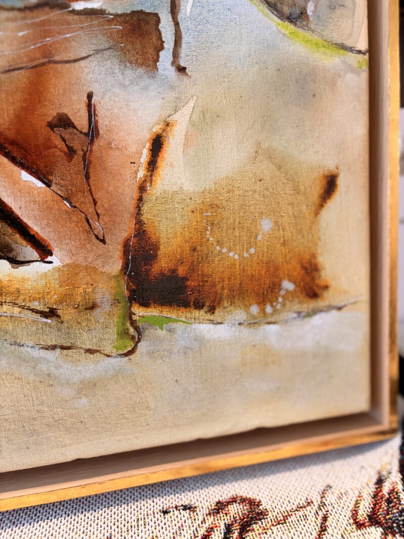 Detail of the corner of the painting showing canvas texture, washes and the frame