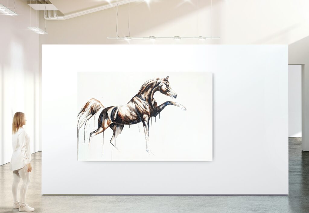 A very large horse painting on a gallery wall with a person beside it for scale