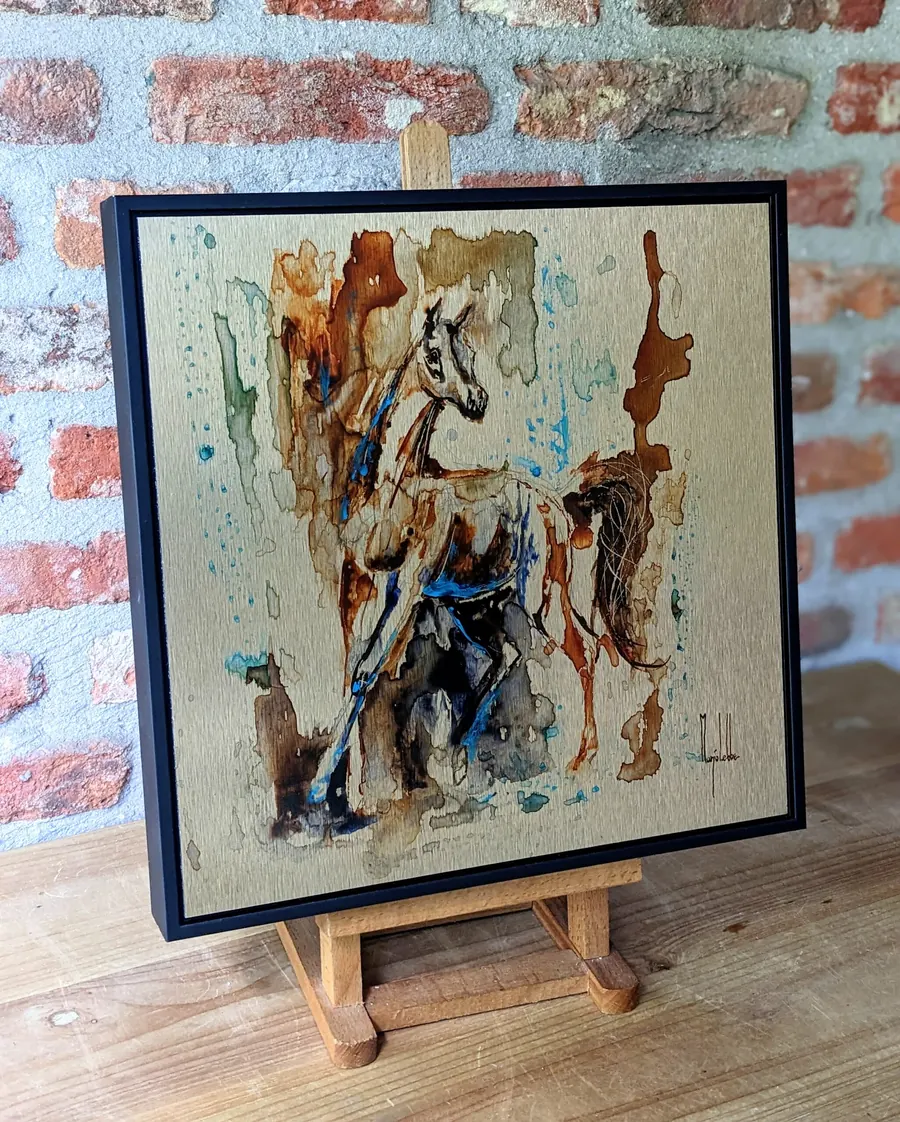An Anima Ferox work seen at an angle, light raking across the brushed metal