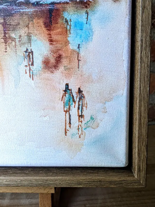 Detail: two small figures painted in turquoise and copper walking side by side across the pale canvas, with the hazel frame at the right