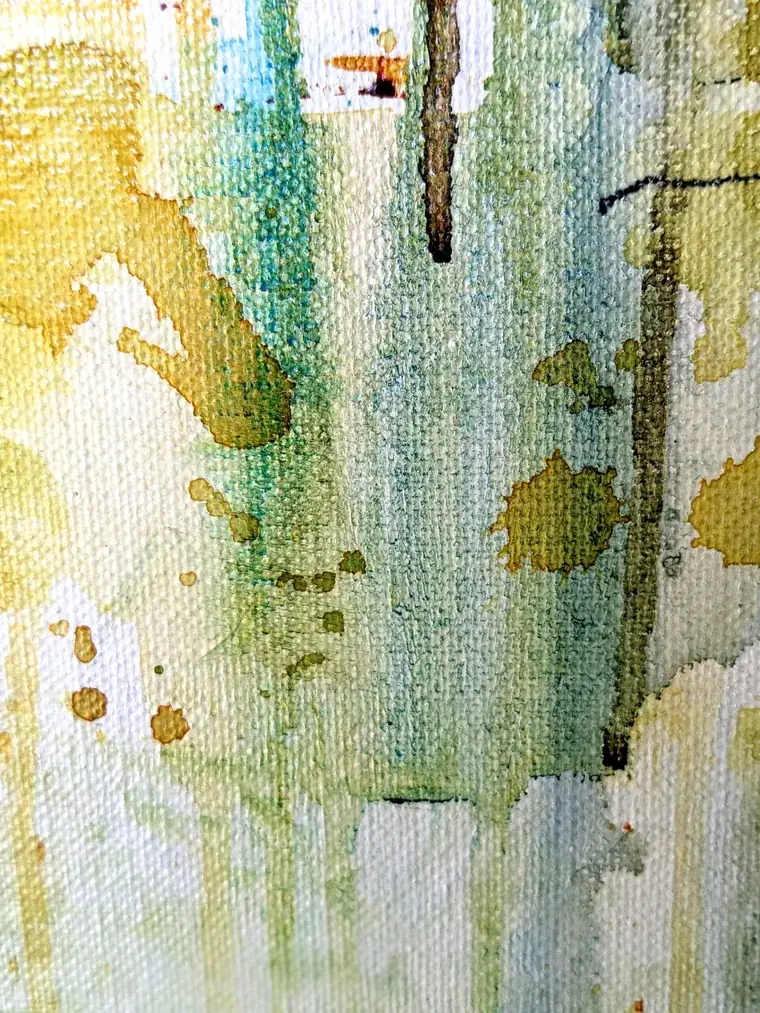 Detail of Aurora: olive-gold and teal watercolour running down the linen in vertical drips