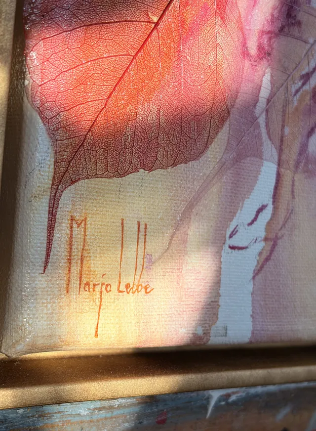 The artist's signature, Marjo Lebbe, painted in the lower corner inside the gold floating frame