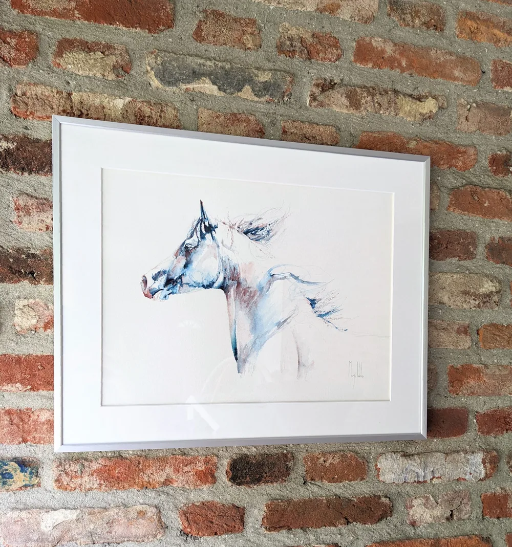 Winter hanging in a silver frame on an old brick wall